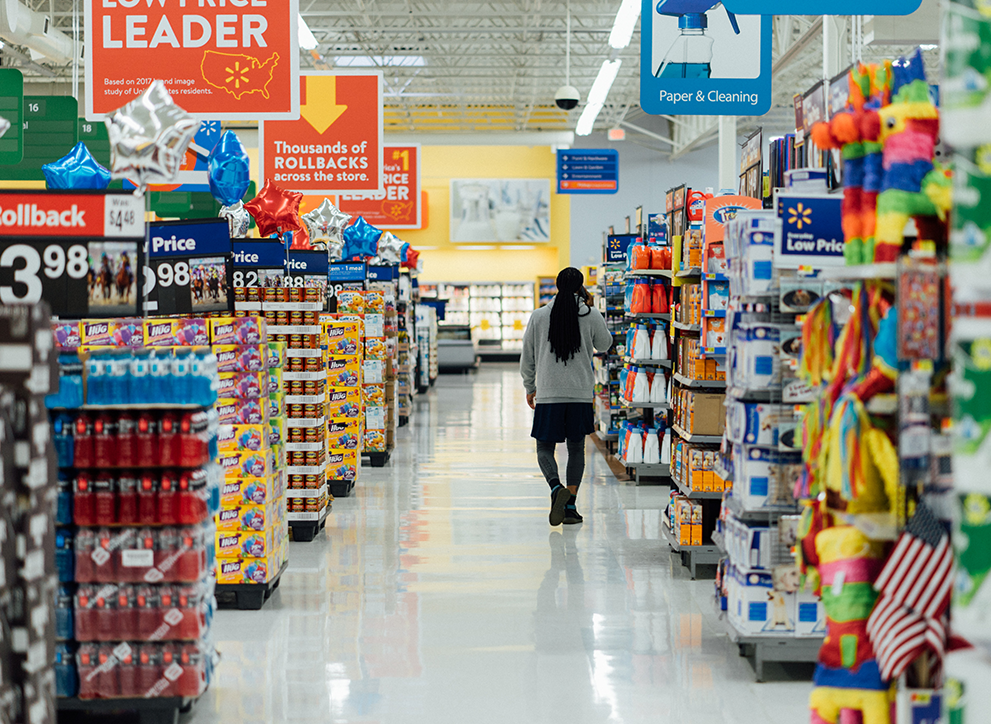 A shopper walks the aisles of a supermarket in the United States.
