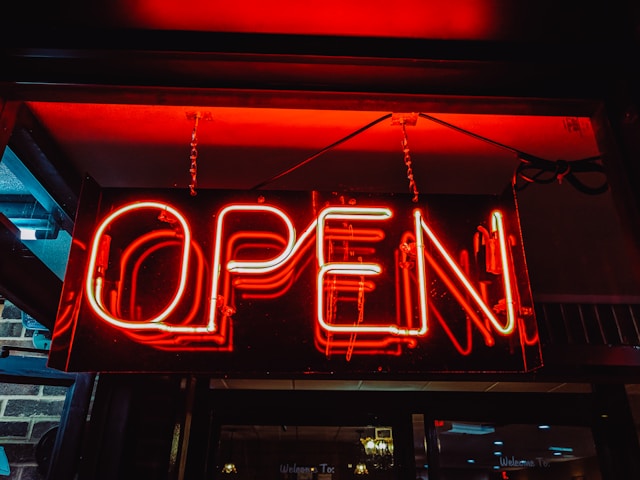 A neon sign saying &quot;Open