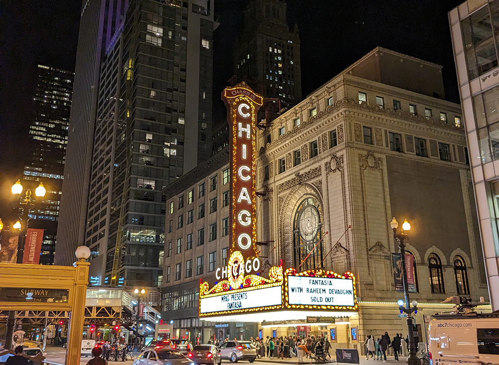 Chicago Theatre sign, illuminated at night.